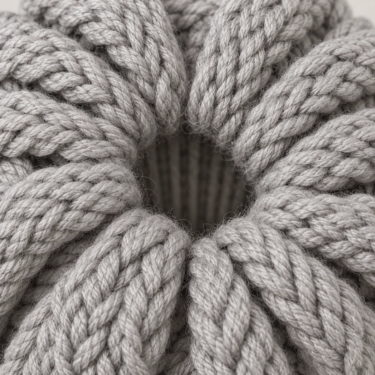 A close view of the gray beanie crown opening