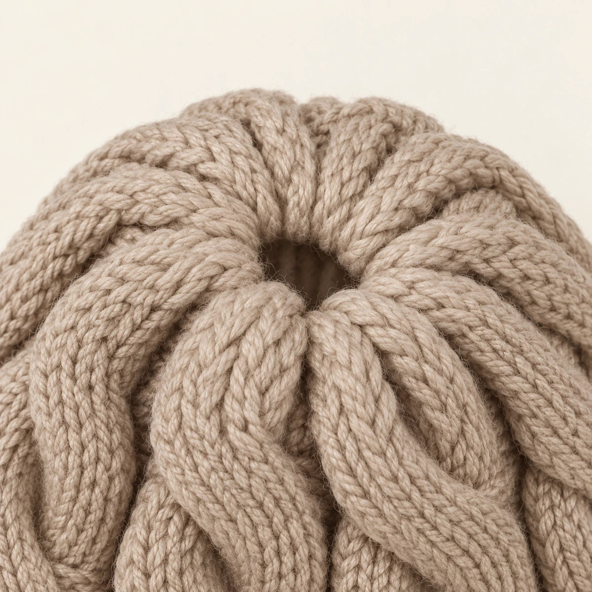 Closeup of the beige beanie crown opening